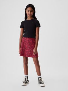 Soft satin classic skirt.  Elasticized waist with lace and ribbon bow details.  Assorted prints.  Easy pull-on waist.  Easy through the hip and thigh.  Hits above the knee. Classic Skirts, Gap Kids, Satin Skirt, Ribbon Bow, Ribbon Bows, Above The Knee, Red Floral, Ribbon, Satin