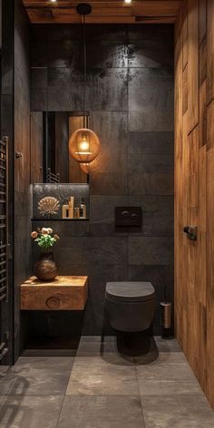 a modern bathroom with wood paneling and tile flooring, along with a toilet