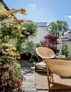 an outdoor patio with wicker furniture and potted plants