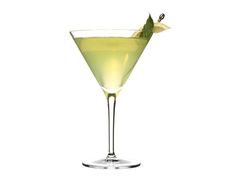 a martini glass with a lime garnish on the rim