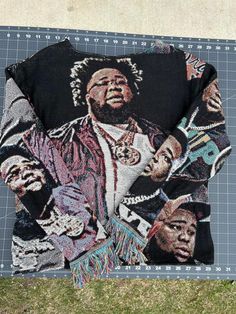 a black shirt with an image of a man on it