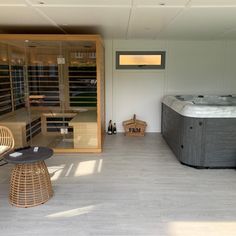 an indoor hot tub and wicker chairs in a room