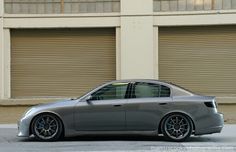 a silver car parked in front of a building