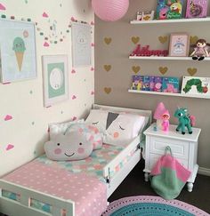 a child's bedroom decorated in pastel colors