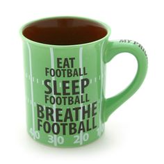 a green coffee mug with the words eat football sleep football breathe football