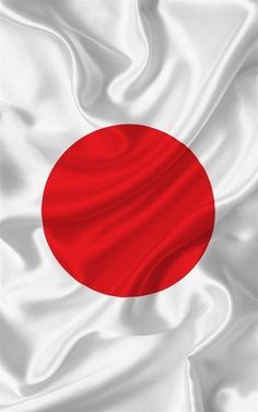 the flag of japan is waving in the wind