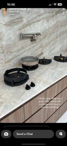 a kitchen counter top with some pots and pans sitting on it's burners