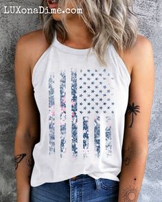 American Flag Floral Graphic Shirt Patriotic Sleeveless Grecian Tank Top This classic Americana-style t-shirt is ideal for the all-American woman !Features an American flag in a subtle floral pink print in a rustic retro vintage style.Grecian spaghetti strap cami shirt is comfortable, lightweight, slightly stretchy.Perfect for pairing with jeans or shorts for the summer.Wear everyday showing your love our military troops, holidays like 4th of July, independence day, Veterans or election season. Americana Style, Classic Americana, Cami Shirt, Vintage American Flag, Blank Apparel, American Flag Print, Halter Tank Top, Graphic Tank Tops, Americana Fashion