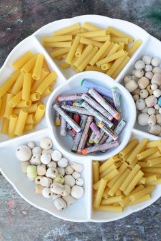 a white plate topped with pasta and other foods