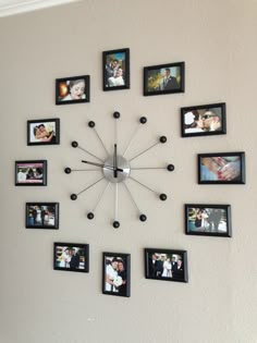 a large clock with many pictures on it's face is hanging on the wall