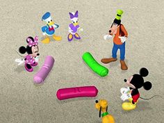 mickey mouse and other cartoon characters on the ground