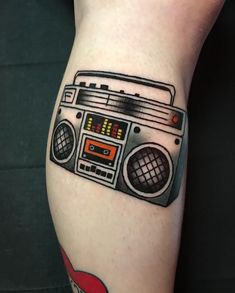 an old school radio tattoo on the leg