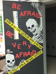 a door decorated to look like a skeleton with the words be afraid, be very afraid written on it