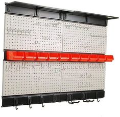 a wall mounted pegboard with red and black bins