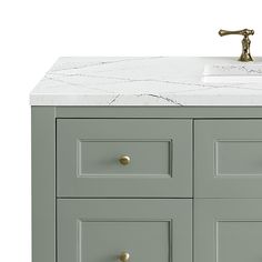 a bathroom vanity with marble top and drawers