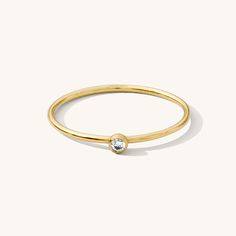 Minimal and sweet, the Tiny Solitaire Ring is ideal for every day. It adds the perfect hint of sparkle and confidence to any occasion. Wear it for your next weekend brunch or girls' night out. It's even comfortable enough to leave on for your favorite yoga class! DETAILS 14k gold filled -or- sterling silver ring 1mm band with 2mm cubic zirconia Available in sizes 5-10 Safe for sensitive skin & shower safe Matching jewelry: Tiny Solitaire Necklace, Solitaire Necklace, Solitaire Ring, Tiny Solita April Birthstone Ring, Dainty Initial Necklace, Multiple Rings, Opal Ring Gold, Opal Earrings Stud, Opal Studs, Gold Filled Ring, Matching Jewelry, Waterproof Jewelry