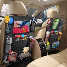 the back seat of a car filled with various items