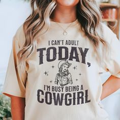 MelsBodega.etsy.com This super cute cowgirl shirt has a little distressed design to give it a vintage vibe. It is a crewneck with a relaxed fit. This will for sure be your softest and most comfy tee in your wardrobe. It would make as a great gift for the cowgirl in your life! Each shirt comes in ivory,espresso,blue jean, and moss shirt colors.  Comfort Colors introduces the "Comfort Colors 1717" garment-dyed t-shirt; a fully customizable tee made 100% with ring-spun cotton. The soft-washed, garm San Jose, Cowgirl T Shirts For Women, Western Shirts For Women, Cute Cowgirl, Retro Cowgirl, Cowgirl Shirts, Cow Girl, Vintage Vibe, Western Shirt