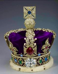 a crown with jewels on it is shown in an advertisement for the royal family's coronation