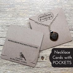 two necklaces with cards attached to them