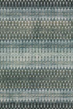 an area rug with different colors and patterns on it's sides, including blue, grey