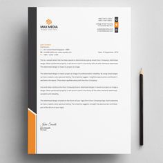 an orange and black letterhead on top of a white paper next to a pencil