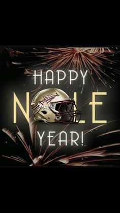 a football helmet with fireworks in the background that says happy new year's eve