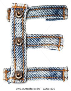 the letter e made out of jeans with metal rivets stock photo, images and royalty