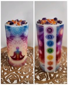 two cups with different designs on them sitting on a table