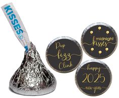 three herspooos wrapped in foil with the words happy new year on them