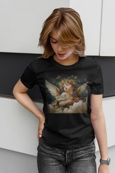 Trending Cherub baby Angel renaissance graphic Unisex Softstyle T-Shirt, praying, chatolic style, christian, faith, angel gifts, angele tee tshirt aesthetic, aesthetic tshirt girls, aesthetic graphic tshirt, aesthetic oversized tshirt, Christian aesthetic t-shirt, angel aesthetic, graphic t-shirt aesthetic, cottagecore aesthetic t-shirt,  oversized tee aesthetic, The unisex soft-style t-shirt puts a new spin on casual comfort. Made from very soft materials, this tee is 100% cotton for solid colors. Heather colors and sports grey include polyester. The shoulders have twill tape for improved durability. There are no side seams. The collar is made with ribbed knitting to prevent curling damage.  .: 100% ring-spun cotton (fiber content may vary for different colors) .: Light fabric (4.5 oz/yd² Shibuya Style, Gothic Tees, Cherub Baby, Cherub Angel, Angel Gifts, Angel Painting, Aesthetic T Shirts, Gothic Fashion, Victorian Fashion