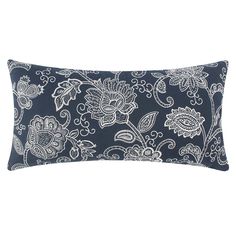 a black and white pillow with paisley print on it