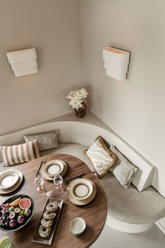 an overhead view of a dining table with plates and bowls