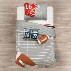 an overhead view of a football themed bedding set