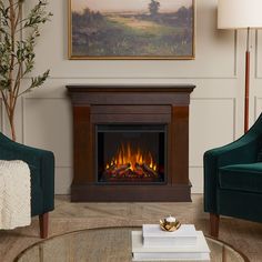 a living room with two chairs and a fire place in the middle of the room