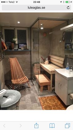 a bathroom with a sink, shower and bench in it's center area is shown on the instagram