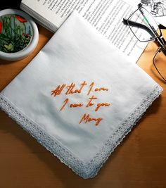 an embroidered napkin with the words, all that i love is you may on it