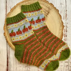 This listing is for a digital download of the pattern for my Hello Pumpkin Socks.  They are knitted from the cuff down, with a simple flowers and pumpkin colourwork motif, a special leaf stitch tops each pumpkin and there is an autumnal stripe running the length of the foot before a repeat of the yellow flowers.  They are made with a heel flap and gusset and Kitchener stitch to graft the toe - there is a tutorial for this step on my YouTube Channel if you need it and I will provide you with a QR Sunflower Socks Knit, Hufflepuff Socks Knitting, Knitting Harry Potter Socks, Hand Knitted Socks, Colourwork Socks, Knit Flower Pattern, Knitted Socks Pattern, Knit Socks Tutorial, Knit Socks Pattern