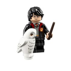 a lego harry potter with an owl on his arm and a wand in his hand