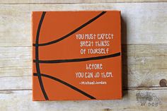 an orange canvas with a basketball quote on it