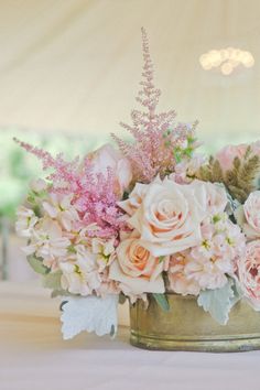 an instagram photo with pink flowers in a tin