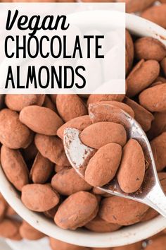 a spoon full of chocolate almonds with the words vegan chocolate almonds