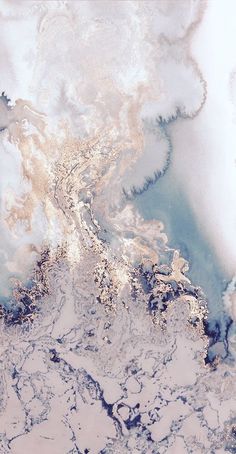 an aerial view of water and land in the ocean with blue, white, and gold colors