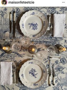 the table is set with blue and white china