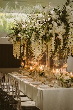 the table is set with candles and flowers