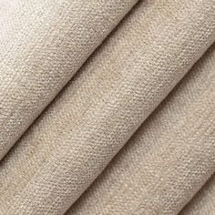 a close up shot of the fabric material for a curtain or drapes in beige