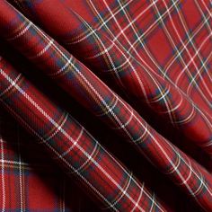 a red plaid fabric with white and blue checks on it's side, as well as