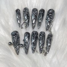 These are handmade press on's created by me! What's included? - 10 nails - nail glue - file - cuticle pusher - instructions Nail Shape in the photo: Long Stiletto Nails are made to order so you can pick any length, size, and shape. Please know that order processing time is 5-7 business days because the nails need to be made and personalized to your preference. They can last 1-3 weeks depending on how well you prep your nails. Message me if you would like a custom press on set! Long Nails With Charms, Ongles Goth, Nails With Charms, Nail Piercing, Long Stiletto, Punk Nails, Gothic Nails, Goth Nails, Grunge Nails