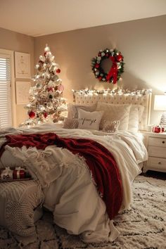 a bedroom decorated for christmas with a tree