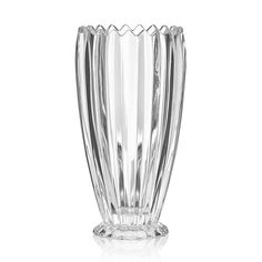 a clear glass vase sitting on top of a white table